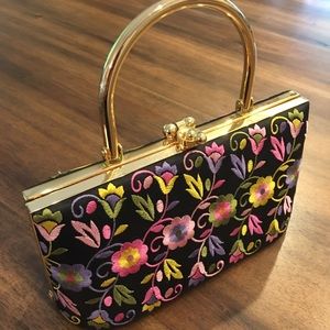 Hard shell small handbag with floral embroidery